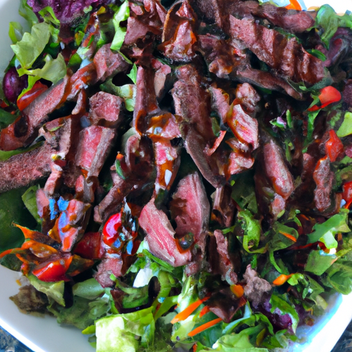 Colorful steak salad drizzled with balsamic vinaigrette